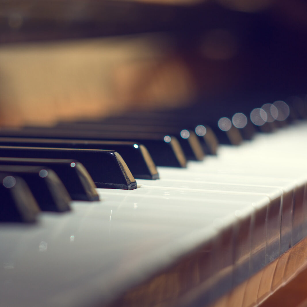 Piano keyboard background with selective focus Piano keyboard background with selective focus. Warm color toned image